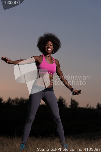 Image of black woman is doing stretching exercise relaxing and warm up