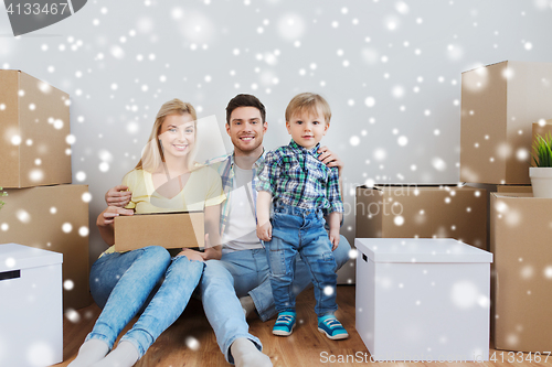 Image of happy family with boxes moving to new home