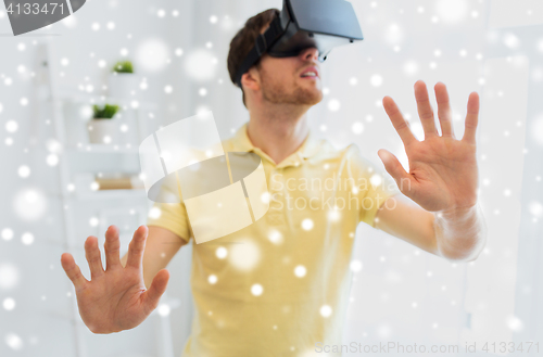 Image of young man in virtual reality headset or 3d glasses