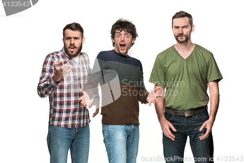 Image of The three men are smiling, looking at camera