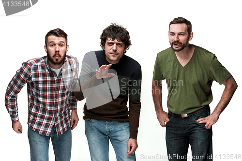 Image of The three men are smiling, looking at camera