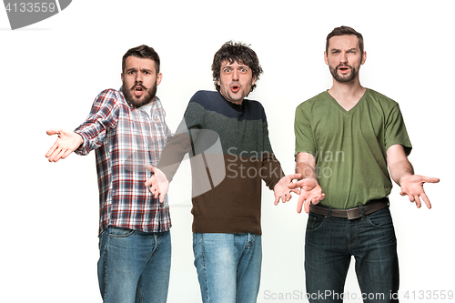 Image of The three men are smiling, looking at camera