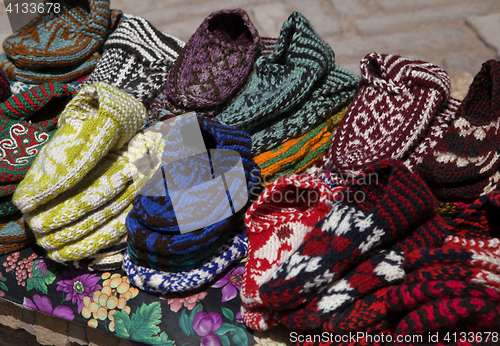 Image of Knitted slippers in a street market, Uzbekistan