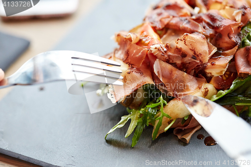 Image of close up of prosciutto ham salad at restaurant