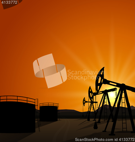 Image of Oil pump jack for petroleum and reserve tanks on sunrise backgro