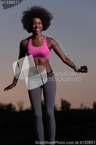 Image of black woman is doing stretching exercise relaxing and warm up