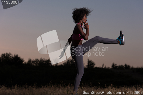 Image of black woman is doing stretching exercise relaxing and warm up