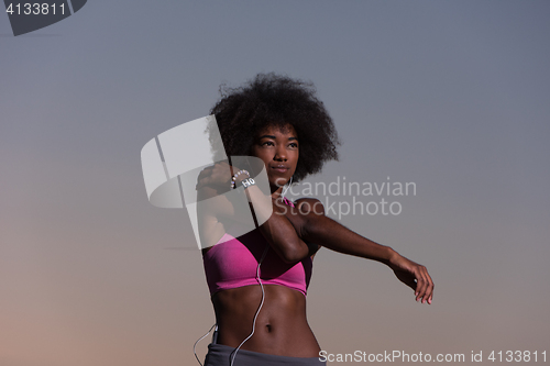 Image of black woman is doing stretching exercise relaxing and warm up