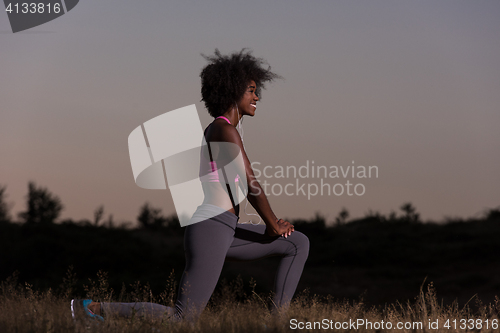 Image of black woman is doing stretching exercise relaxing and warm up
