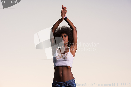 Image of young black woman in nature