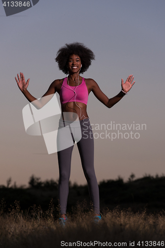 Image of black woman is doing stretching exercise relaxing and warm up