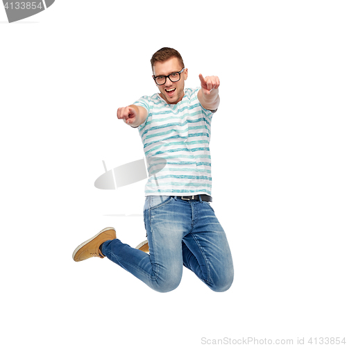 Image of happy man jumping and pointing fingers to you