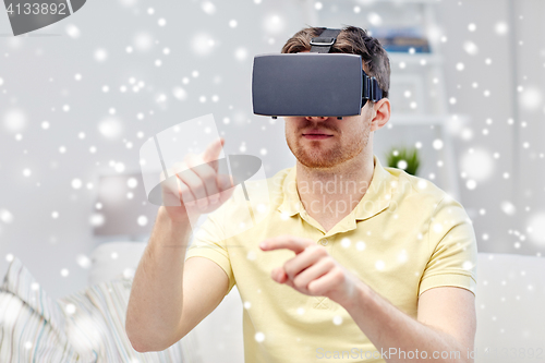 Image of young man in virtual reality headset or 3d glasses