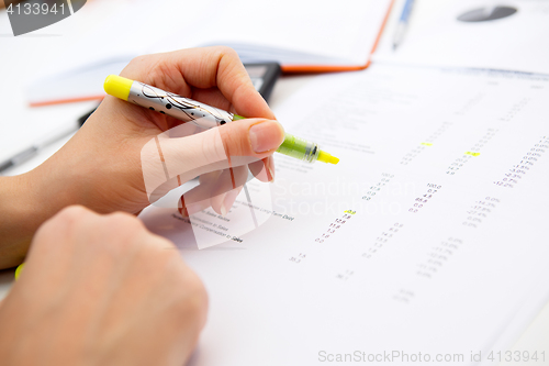 Image of Table girl work with accounting records