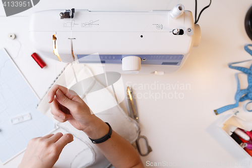 Image of Dressmaker with sewing-machine top view