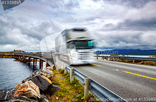 Image of Truck and highway at sunset