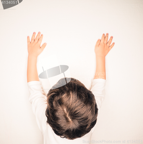 Image of Closeup of beautiful brown hair on unrecognizable boy, stretchin