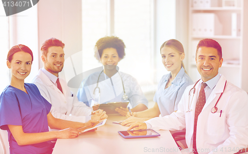 Image of group of happy doctors meeting at hospital office