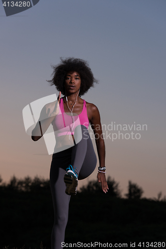 Image of black woman is doing stretching exercise relaxing and warm up