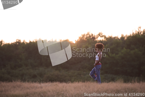 Image of young black woman in nature