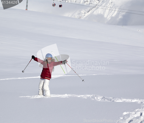 Image of Happy girl on off-piste slope with new fallen snow at nice winte