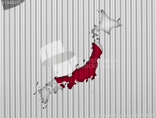 Image of Map and flag of Japan on corrugated iron