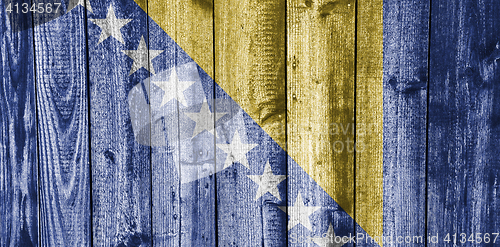 Image of Flag of Bosnia and Herzegovina on weathered wood