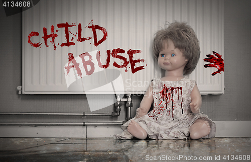 Image of Concept of child abuse - Bloody doll