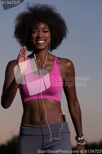 Image of black woman is doing stretching exercise relaxing and warm up