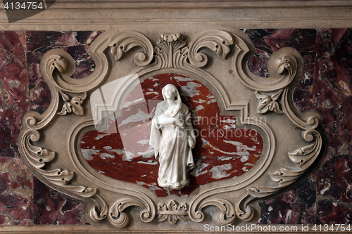 Image of Virgin Mary detail of the medieval church altar