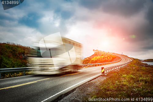 Image of Truck and highway at sunset