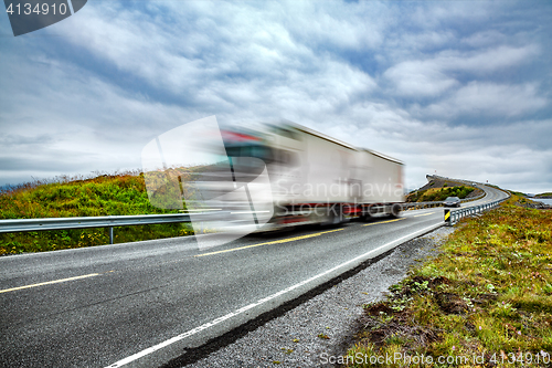 Image of Truck and highway at sunset