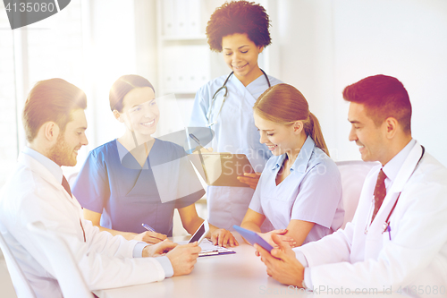 Image of group of happy doctors meeting at hospital office