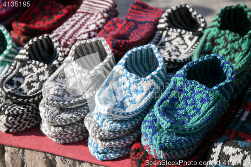 Image of Knitted slippers in a street market, Uzbekistan