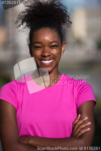 Image of Portrait of sporty young african american woman running outdoors