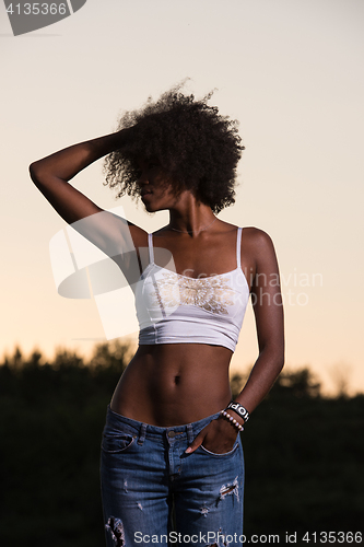 Image of young black woman in nature