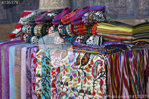 Image of Scarves and knitted slippers in a street market, Uzbekistan