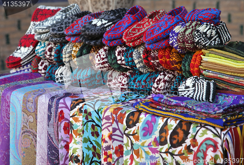 Image of Scarves and knitted slippers in a street market, Uzbekistan