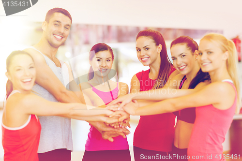 Image of group of people in the gym celebrating victory