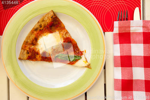 Image of slice of pizza Margherita on a plate