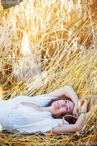 Image of woman lying in the grass