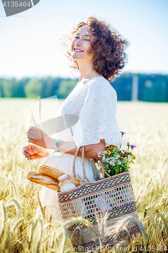 Image of beautiful middle aged woman with bag