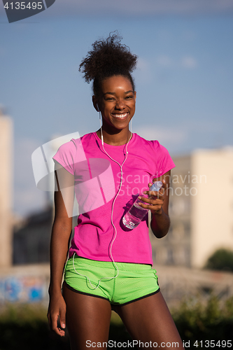 Image of african american woman running outdoors