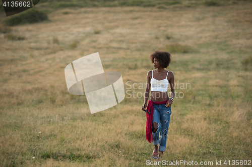 Image of young black woman in nature