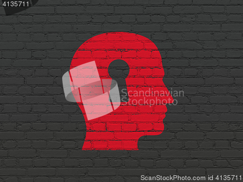 Image of Studying concept: Head With Keyhole on wall background