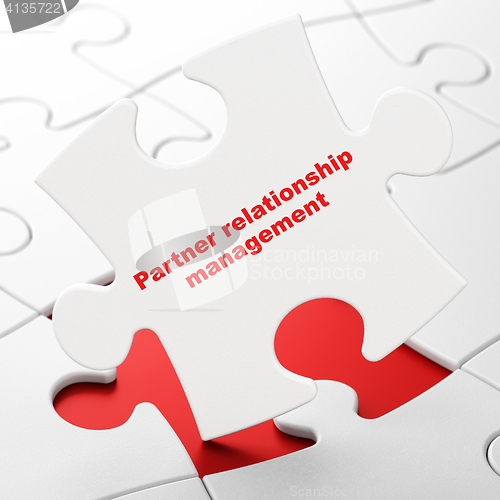 Image of Finance concept: Partner Relationship Management on puzzle background