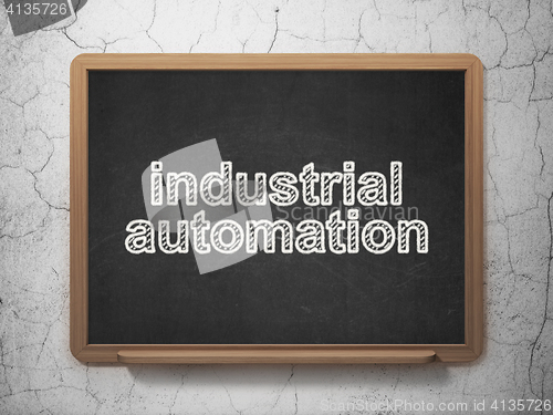 Image of Manufacuring concept: Industrial Automation on chalkboard background