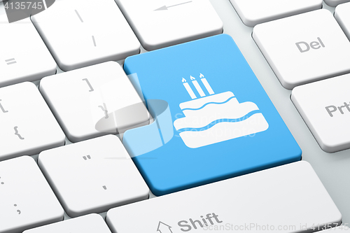 Image of Holiday concept: Cake on computer keyboard background