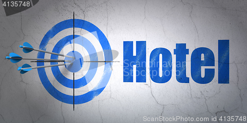 Image of Travel concept: target and Hotel on wall background