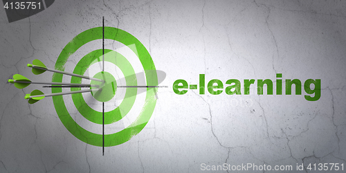Image of Studying concept: target and E-learning on wall background